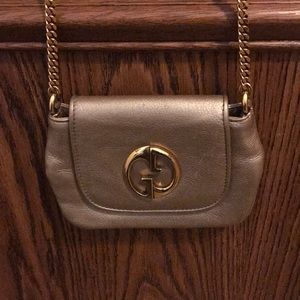 Gucci purse 7 in by 5.5 inch gold chain
